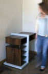 Wedged Walnut Cabinet - Furniture Design: Scale Figure Walking By the Cabinet